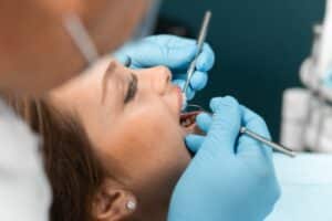 A close-up shot of a woman getting a dental exam in Melville, NY