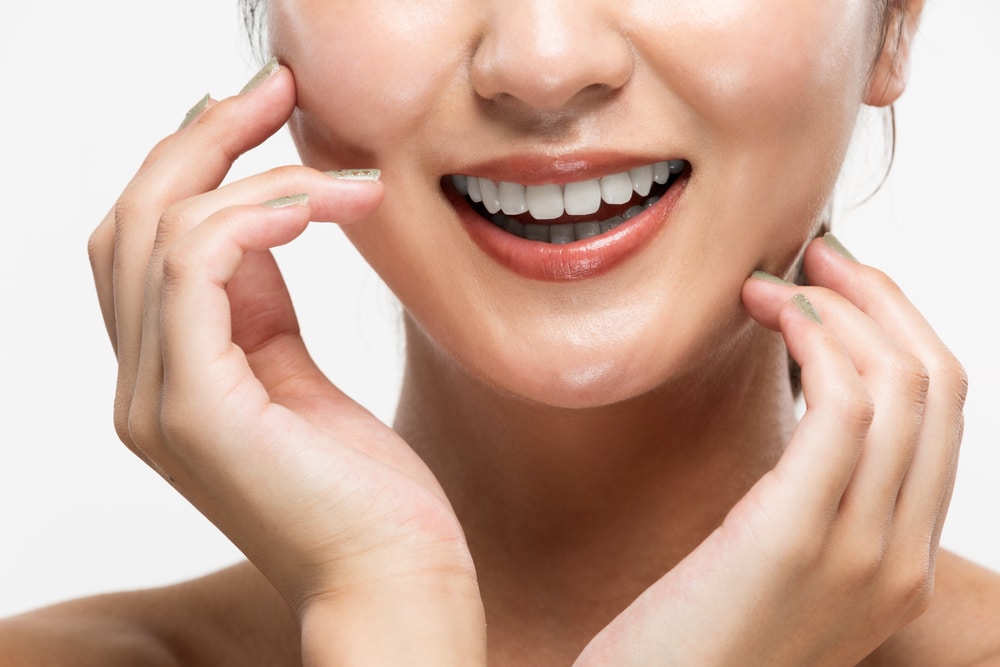 A close-up shot of a woman's smile after 3D facial scanning in Melville