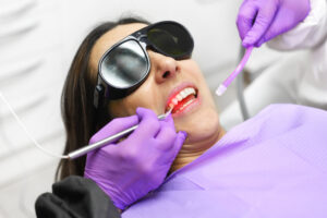 woman receiving laser dentistry woman receiving laser dentistry